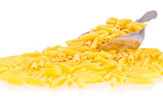 Penne pasta flowing from a scoop