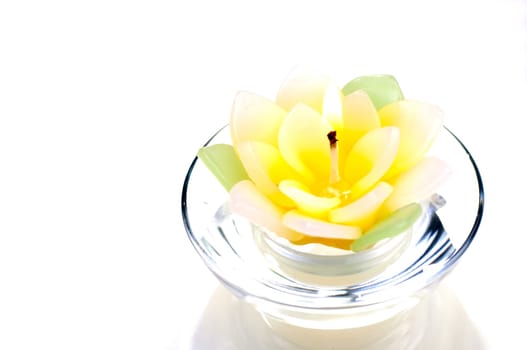 Lotus candle with a flame close up