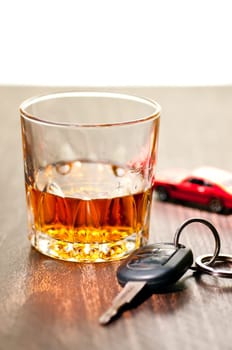 Whiskey neat with a car key indicating don't drink and drive