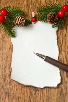 blank note with christmas decoration on wooden background