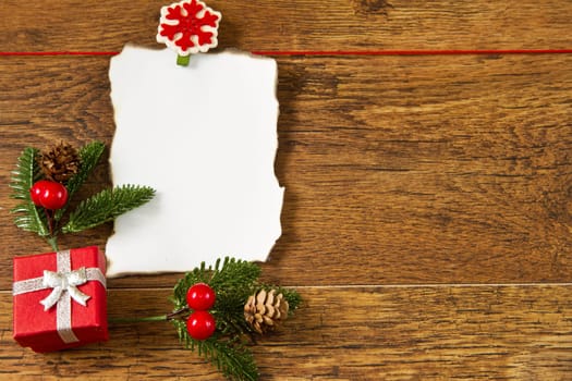 blank note with christmas decoration on wooden background