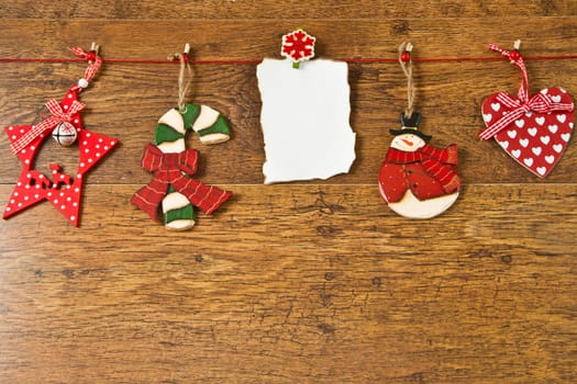 blank note with christmas decoration on wooden background