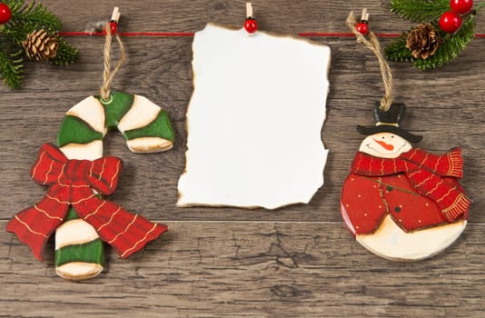 blank note with christmas decoration on wooden background
