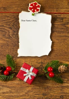 blank note with christmas decoration on wooden background