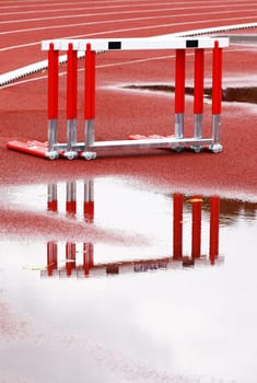 Hurdles near the runway on a wet, rainy day
