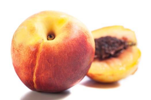 Whole and sliced fresh ripe Nectarines on an isolated background