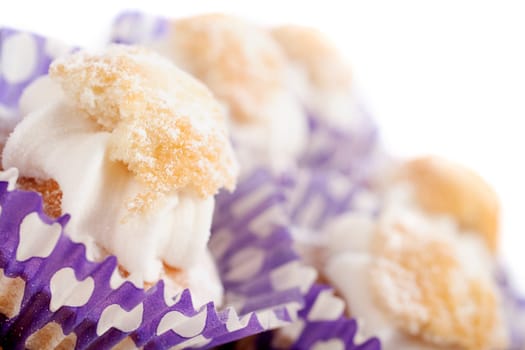 Freshly baked cup cakes with cream filling in cake trays