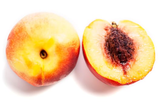 Whole and sliced fresh ripe Nectarines on an isolated background