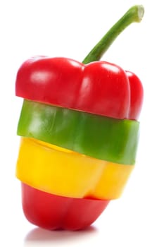 Red Yellow and Green peppers sliced and mixed up to look like one pepper on isolated white background