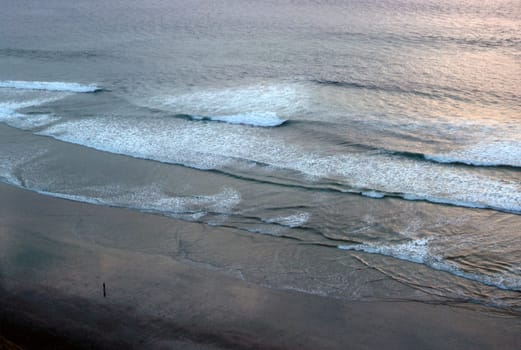 Lone man on Pacific beach
