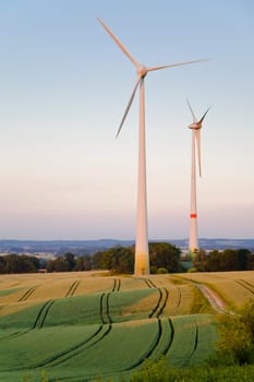Windmills at dusk, an alternative energy source