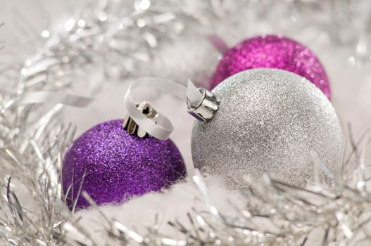 three colorful christmas balls close up shot