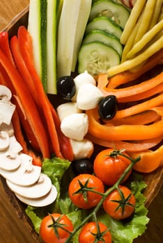 fresh sliced vegetables and mozzarella close up shoot