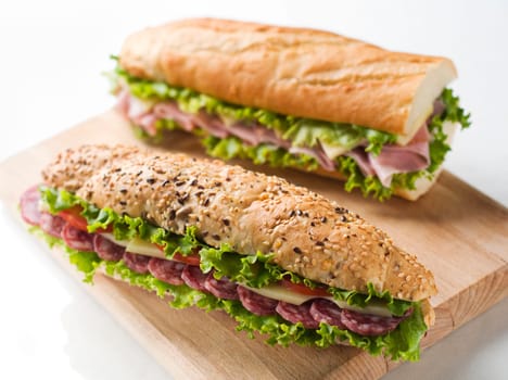 Fresh salami, cheese and tomato sandwich close up