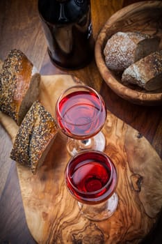 Two glasses of red wine with bread
