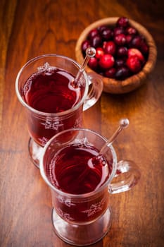 Hot drink with cranberries on white