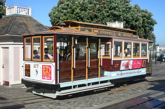 SAN FRANCISCO, CA - JUNE 13,  2008: San Francisco cable car starts another busy day leaving the Hyde Street turntable.
