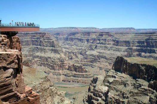 The glass skywalk observation bridge suspended four thousand feet above the Colorado River on the edge of the Grand Canyon West.