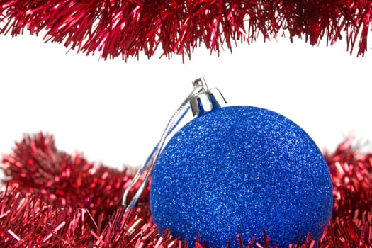 Christmas tinsel and blue bauble with copy space for your text
