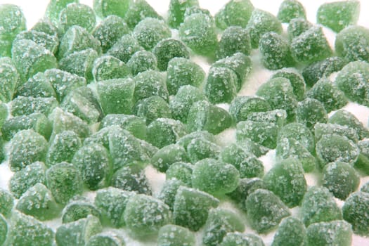 green sugar jelly mints isolated on white background sweets and candy with copy space
