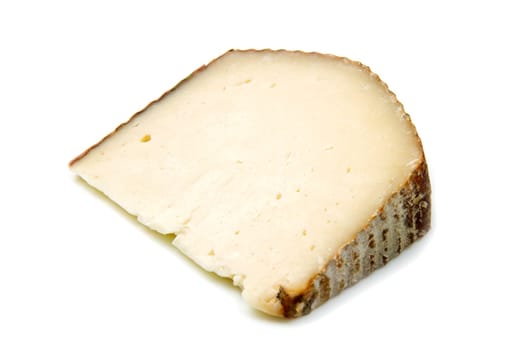 a piece of goat cheese isolated on white