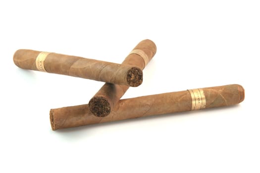three large cuban cigars isolated on white background luxury and abuse concepts