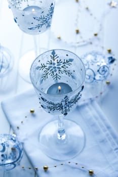 Christmas candles and ornament in blue tone and blurred background