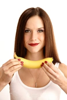 A beautiful brunette shows you her fruit snack