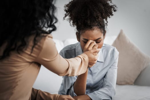 Sad PTSD woman patient in crucial therapy for mental health with psychologist, depression or grief after life failure. Frustrated trauma young woman talking to a psychologist about emotion in clinic