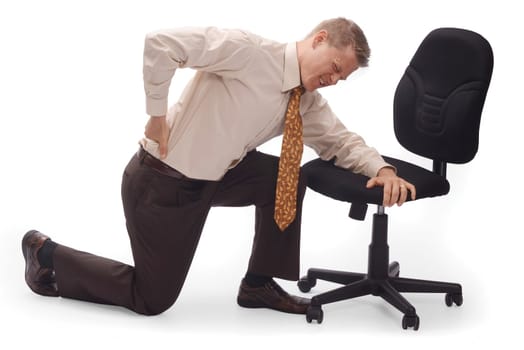 Man kneeling on the floor with back pain on a white background