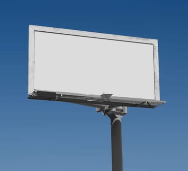 Blank freestanding billboard against a dark blue sky with clipping path for ad area