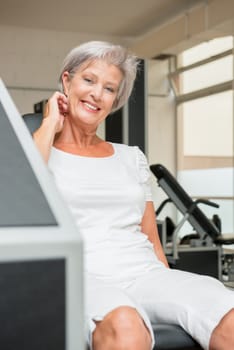 Smiling senior woman in a gym