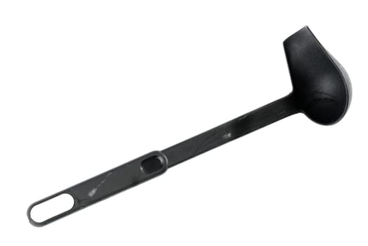 Black soup spoon against white background