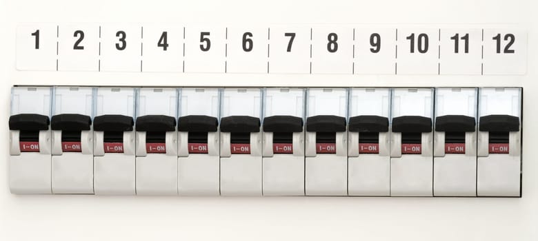 12 fuses on a light-colored wall