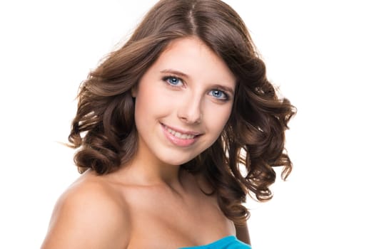 Young and smiling girl against white background
