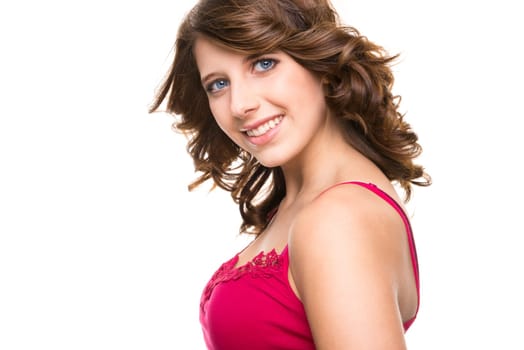 Young and smiling girl against white background