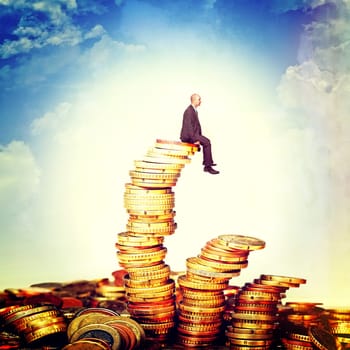 man sit on euro coin piles