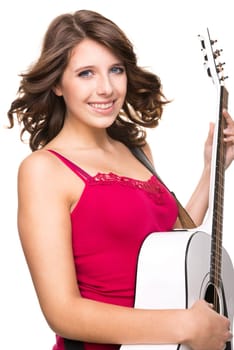 Young and smiling girl with guitar against white background