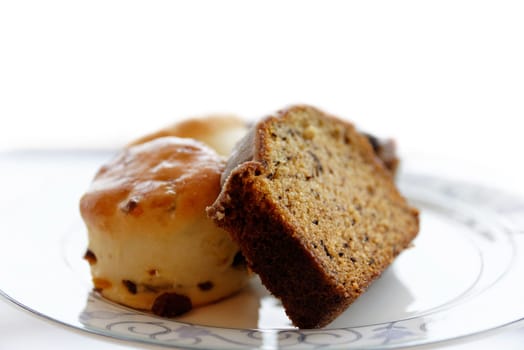 Slice of cake and scones, British afternoon tea