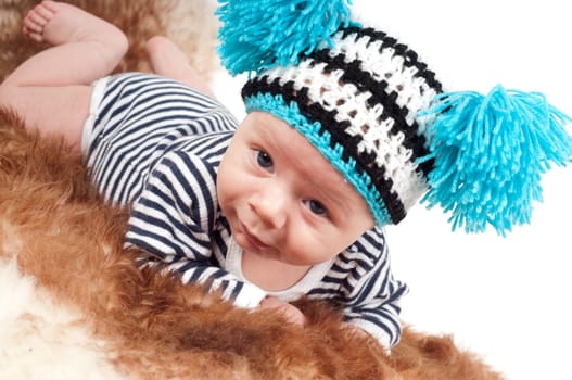 Shot of newborn baby lying on fur