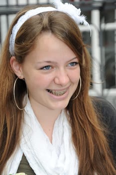 Laughing girl portrait with braces