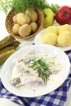 Cream herring with cucumber and jacket potatoes
