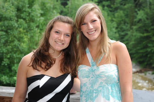 Young laughing women in party outfit