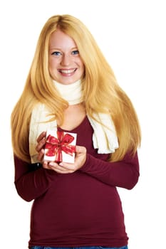beautiful blonde woman holding a christmas gift is smiling