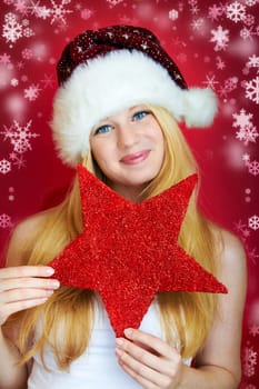 beautiful blonde girl wearing a christmas hat is smiling