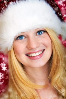 beautiful blonde woman with christmas gift is smiling