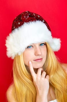 beautiful blonde woman with christmas gift is smiling