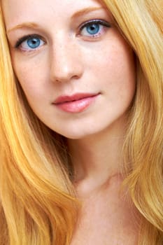 portrait of a beautiful blonde girl with strong and healthy hair