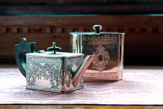 Ancient silver teapot with engraved decoration