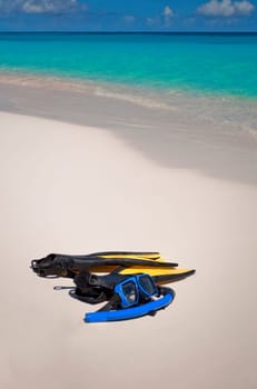 Snorkeling gear on a pristine Caribbean beach.